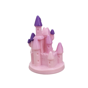 Pink toy castle with purple spires on a white background